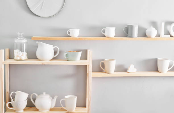 istock Utensils and mugs on shelf. Dishes in cupboard in kitchen. 2198135624