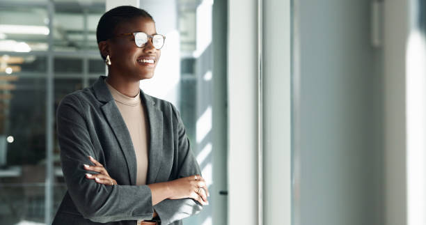 istock Office, thinking and black woman with ideas, arms crossed and future plan for creative problem solving. Proud, smile or happy business advisor daydreaming of profit growth, inspiration or opportunity 2198137834