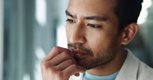 istock Asian, businessman or thinking with decision in doubt for solution, ideas or corporate improvement at office. Man, thoughtful employee or financial accountant with wonder for new business opportunity 2198137875
