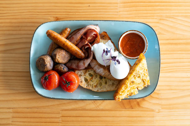 istock Classic Full English Breakfast with Poached Eggs and Sausages 2198138267