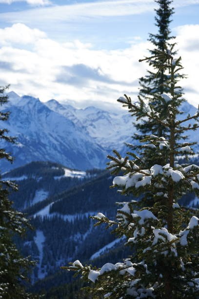 istock Snow and mountains against a blue sky 2198138555