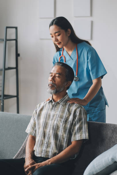 istock Female Physical Therapist Examines the Patient's Neck 2198140191