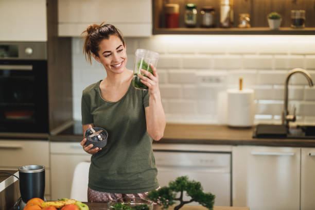 istock Woman Making A Healthy Smoothie At Home 2198143885