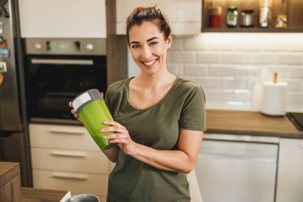 istock Woman Making A Healthy Smoothie At Home 2198143935