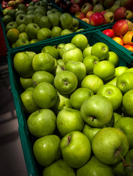 istock green apples in boxes at the supermarket 2198145438