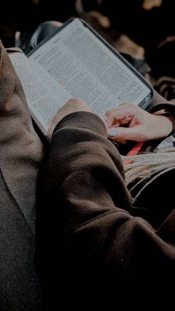 istock a girl reading open Bible 2198145484