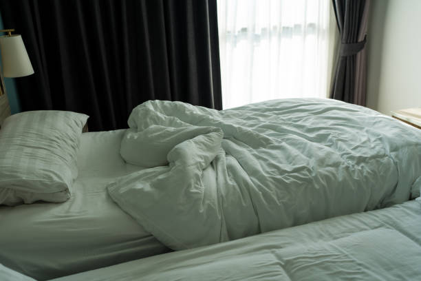 a beautiful photo of a bedside lamp in a hotel room