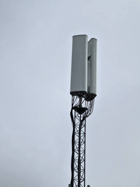 istock The top of a mobile phone communication tower with multiple antennas. A mobile container supplies a signal to an industrial area far outside the city. A container amplifier of mobile operators 2198151134