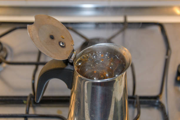 coffee is brewed on the stove in a copper Turk at home