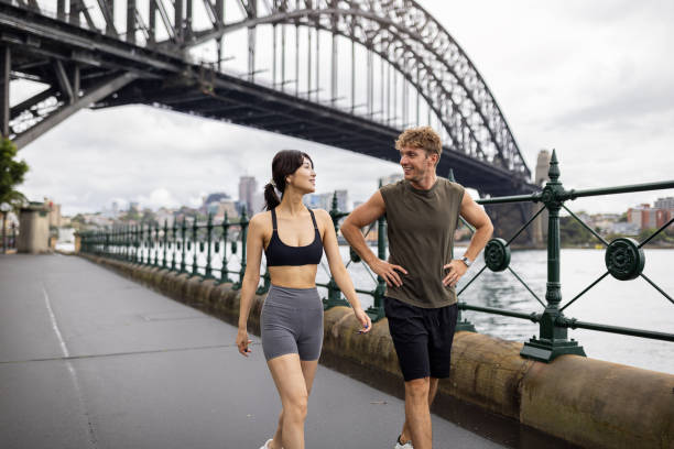 istock Active Friends Walking Near a Bridge in Urban Setting 2198153315