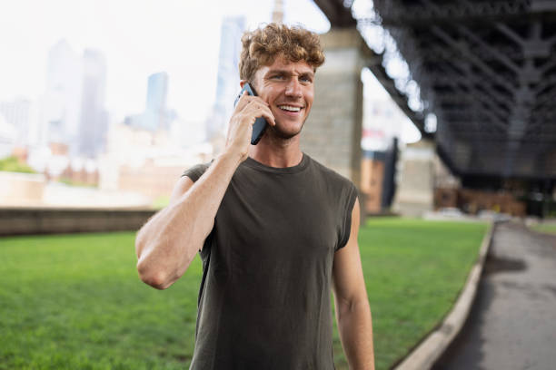 istock Smiling Man Making a Phone Call Outdoors in an Urban Setting 2198154531