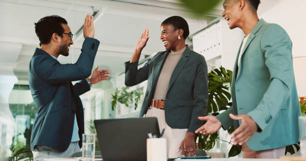 istock Office, high five and report feedback for laptop, proposal and research notes with celebration for team. Man, woman and smile for small business, collaboration and meeting for training or b2b project 2198155179