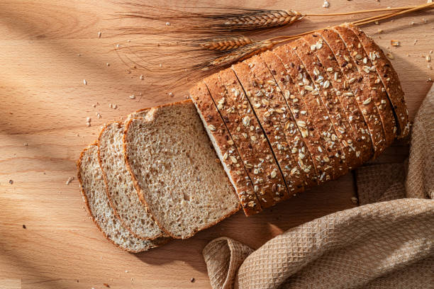 Wholegrain sliced bread shot from above on wood table