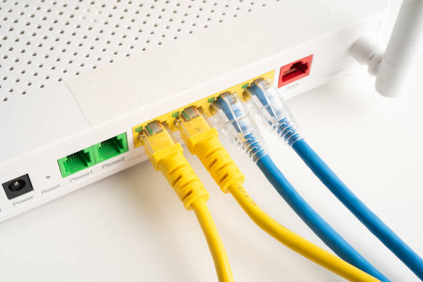 istock Ethernet cable with wireless router connect to internet service provider internet network. 2198164087