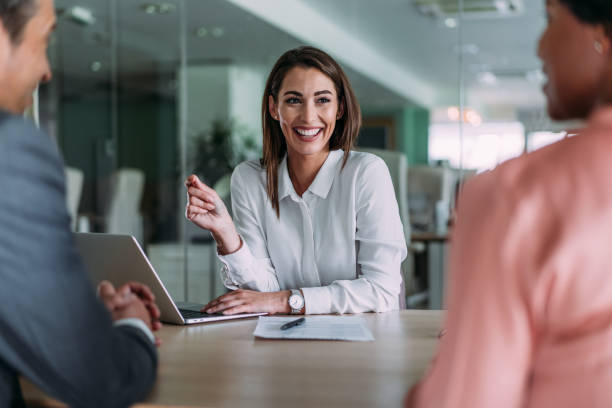 istock Group of business persons talking in the office. 2198168703