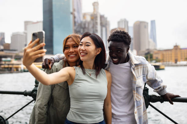 istock Friends Taking a Selfie in an Urban Setting by the Water 2198169177