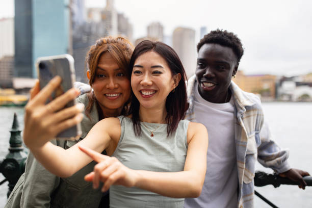 istock Group of Young Friends Taking a Selfie in an Urban Setting 2198169451