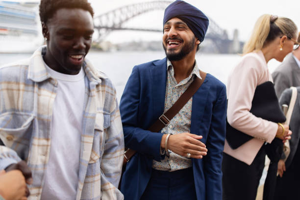 istock Young People Socializing Outdoors in a City With a Famous Bridge 2198169920