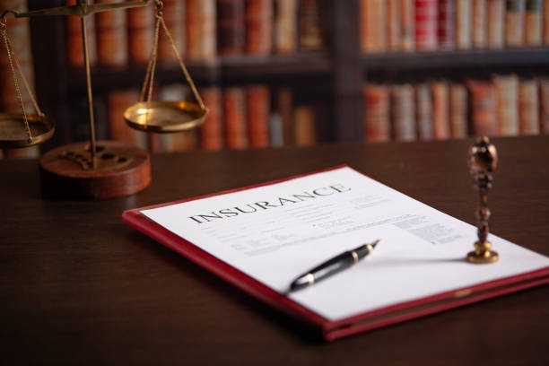 istock Notary's public pen and stamp on a contract. 2198170219