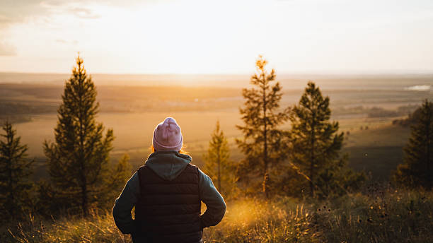 istock A beautiful sunset overlooks a landscape surrounded by tall trees, creating a calm atmosphere ideal for deep reflection and relaxation 2198172271