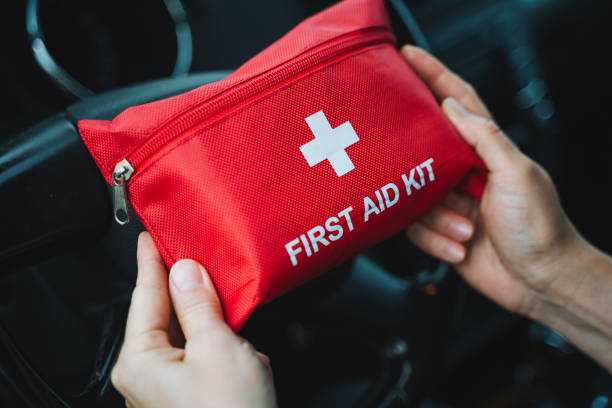 istock A person is firmly holding and grasping a bright red first aid kit securely in their hands, ensuring it is ready for any necessary medical attention or emergencies that may arise 2198172276