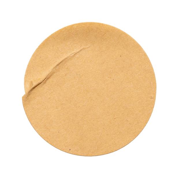 istock Blank craft round paper sticker label cutout isolated on a white background 2198182485
