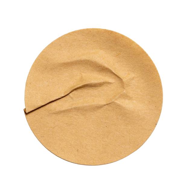 istock Blank craft round crumpled paper sticker label cutout isolated on a white background 2198182496