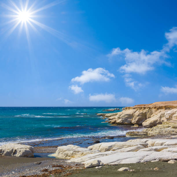 emerald sea with stony coast  at the summer sunny day