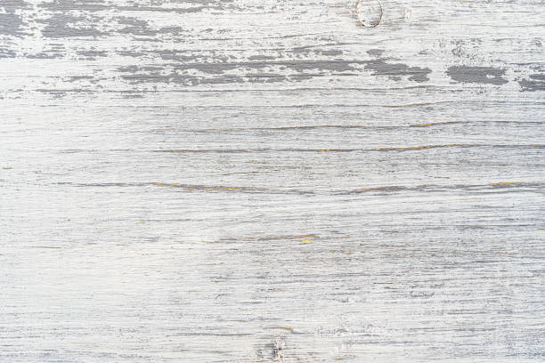 White and gray painted textured wooden plank. Abstract background for design.
