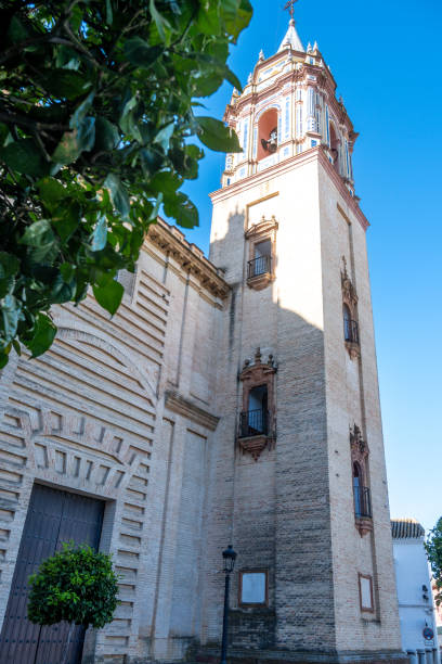 istock Church Tower with Green Tree Leaves 2198188134