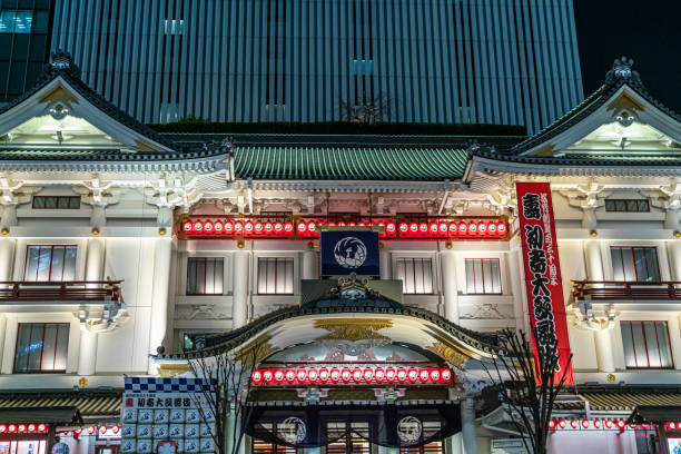 Tokyo, Japan - January 21, 2025: The white facade of the Kabukiza theater dedicated to the traditional kabuki drama form created in a Japanese architectural styles adorned with shining paper lanterns.