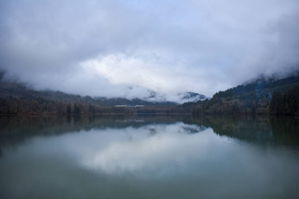 istock Fog running through the trees and over Dexter Lake 2198189094