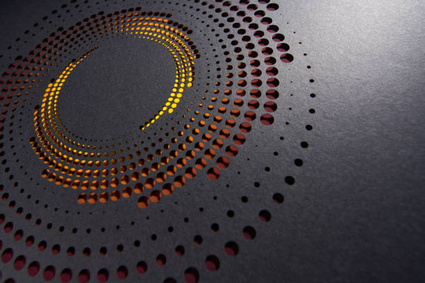 istock Abstract Circular Paper Art with Layered Cutouts on Black Surface and Warm Orange Highlights 2198189905