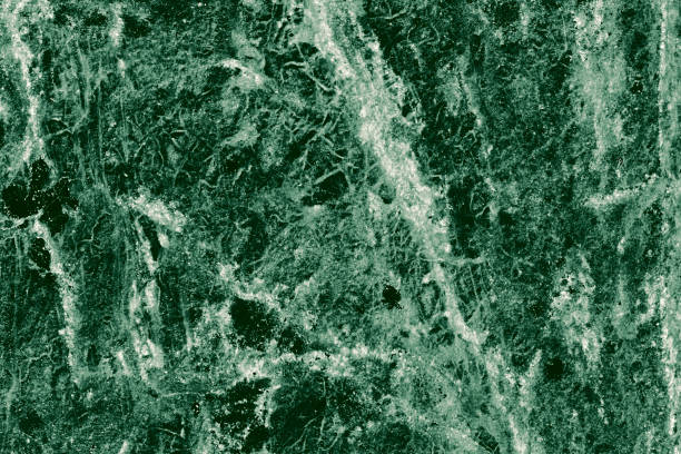 istock Real closeup of dark green marble stone texture surface background. Design pattern with high resolution for luxury home decoration. Abstract matt slab rock material. Front view of natural tiles stone surface. 2198190615