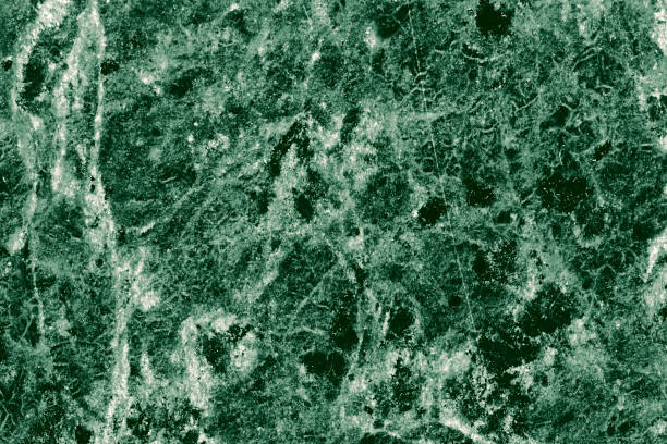 istock Real closeup of dark green marble stone texture surface background. Design pattern with high resolution for luxury home decoration. Abstract matt slab rock material. Front view of natural tiles stone surface. 2198190617