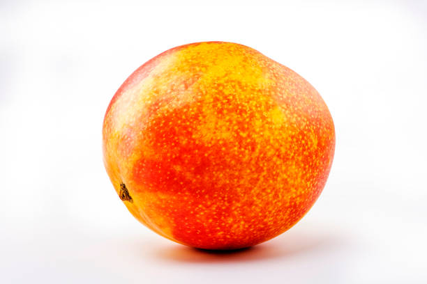 Fresh mango isolated on white background. Skin shot of ripe sweet tropics fruits in Taiwan. Ripe sweet tropics fruits studio shot. Yellow, red colors for background use.