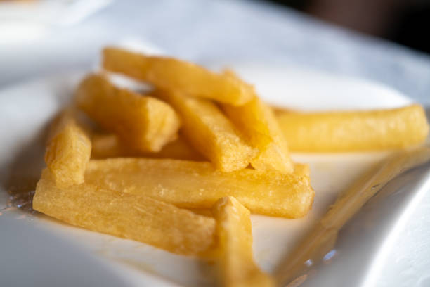 Close up on fried Yucca, served in a restaurant. Made of cassava.