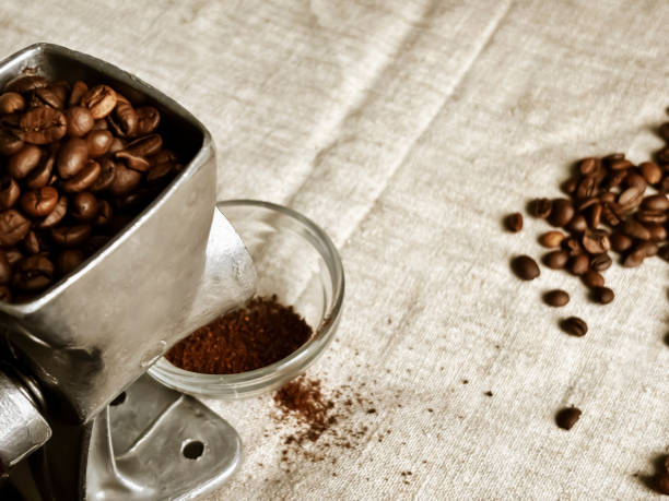 istock Grinding fresh coffee beans in a rustic kitchen during the morning 2198191064