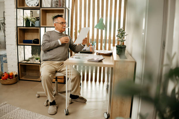 istock Senior man going through his financials 2198191340