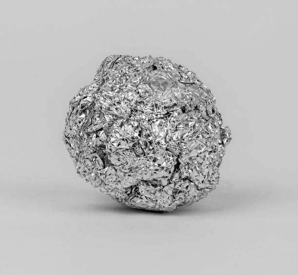 istock Crumpled aluminum foil resting on a white background 2198196699