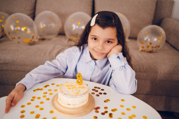istock Little girl celebrating birthday 2198197827