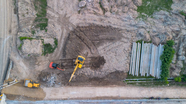 istock Aerial view of excavator working at construction site, top view 2198200885
