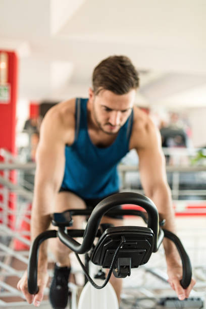man on the cyclette at the gym