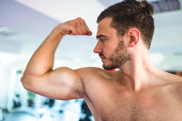 istock macho man showing his muscle 2198202545