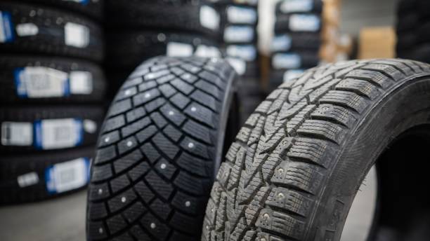 istock Comparison of old and new studded car tires. 2198204576