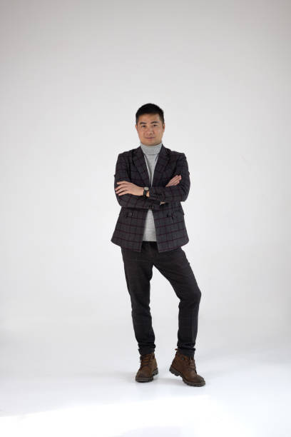 istock Confident Man Posing Stylishly in Formal Attire 2198205295