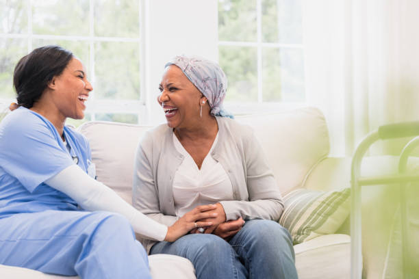 istock Joyful Conversation: Nurse and Patient Sharing a Laugh 2198206069