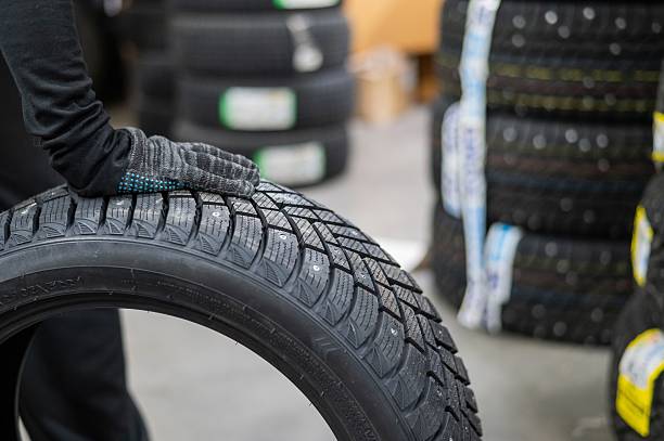 istock Mechanic keeps new studded car tires in garage. 2198207702