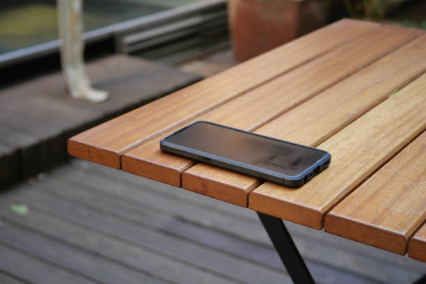 istock forget smartphone on a cafe table , lost smart phone 2198212615