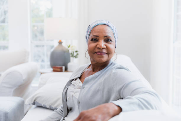 istock Confident Mature Woman in Headscarf Sitting on Sofa 2198213463